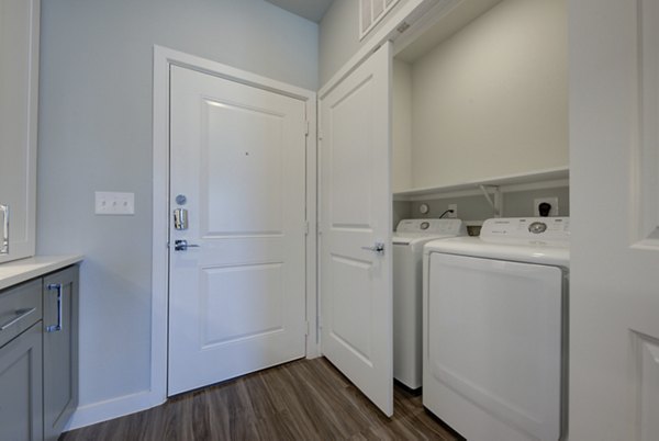 Laundry room featuring energy-efficient washers and dryers at Tacara Westpointe Village Apartments