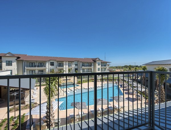 Charming patio with stylish seating at Tacara Westpointe Village Apartments