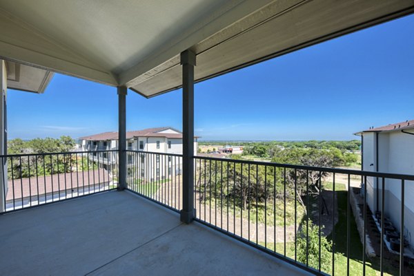 Patio area featuring modern outdoor seating at Tacara Westpointe Village Apartments