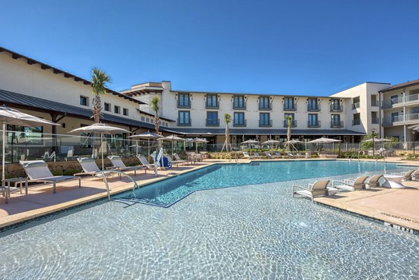 Resort-style pool at Tacara Westpointe Village Apartments, offering luxury leisure experience