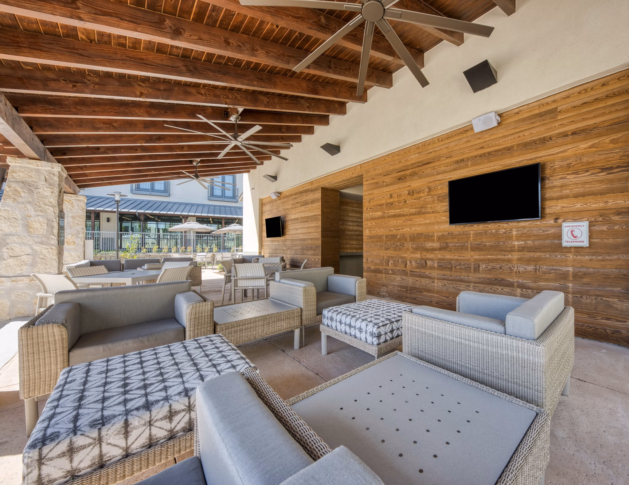 Chic outdoor patio with modern seating at Tacara Westpointe Village Apartments, ideal for relaxation and socializing