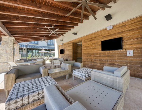 Chic outdoor patio with modern seating at Tacara Westpointe Village Apartments, ideal for relaxation and socializing