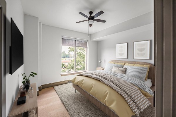 Elegant bedroom with modern decor at The Residence at SouthPark Apartments