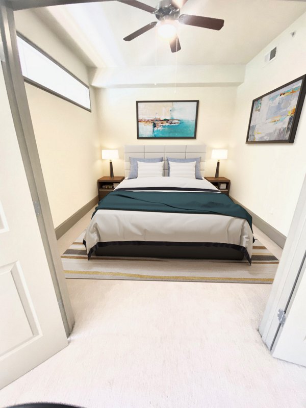 Cozy bedroom with natural light at The Residence at SouthPark Apartments