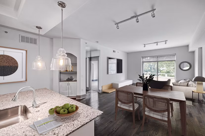 Dining area with elegant lighting and modern furnishings at The Residence at SouthPark Apartments