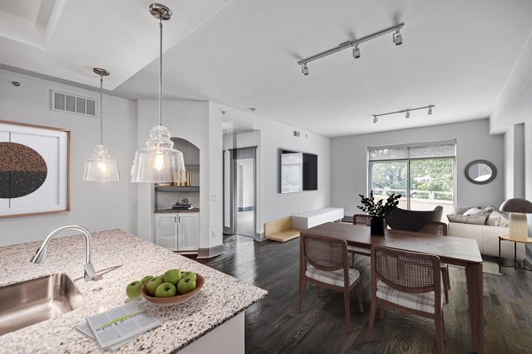 Dining area with elegant lighting and modern furnishings at The Residence at SouthPark Apartments