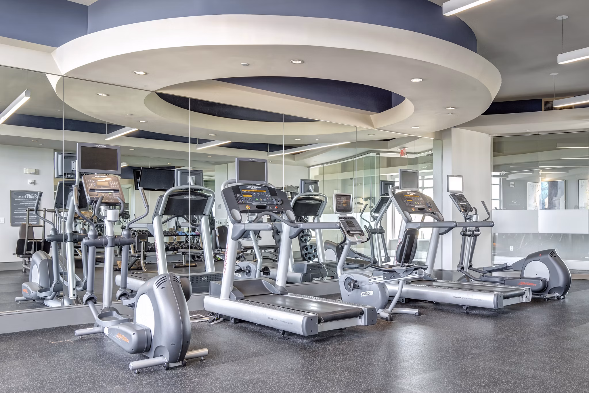 State-of-the-art fitness center at The Residence at SouthPark Apartments with modern equipment and spacious workout areas