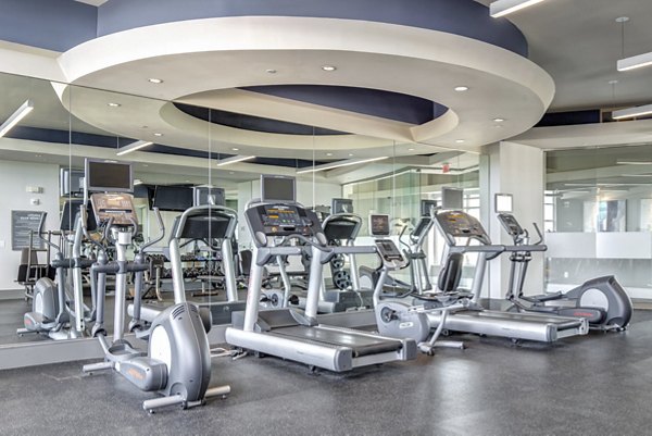 State-of-the-art fitness center at The Residence at SouthPark Apartments with modern equipment and spacious workout areas