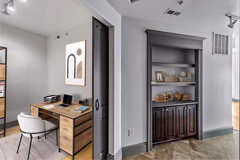 Home office with ergonomic desk and modern decor at The Residence at SouthPark Apartments, ideal for remote work productivity