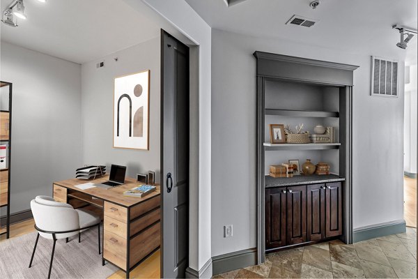 Home office with ergonomic desk and modern decor at The Residence at SouthPark Apartments, ideal for remote work productivity