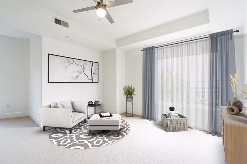 Elegantly furnished living room with modern decor at The Residence at SouthPark Apartments