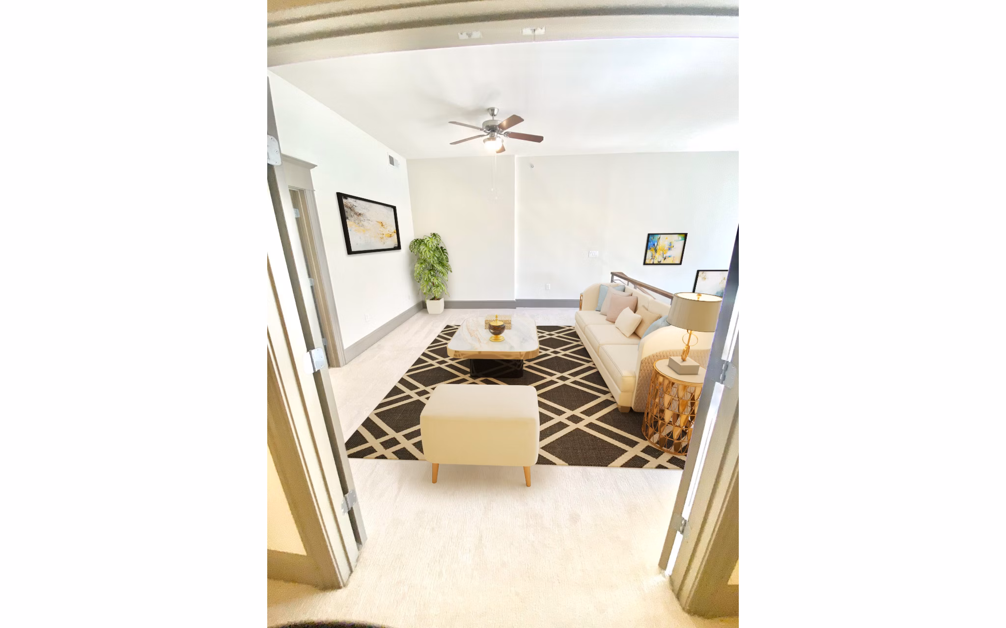Spacious living room with modern furnishings in The Residence at SouthPark Apartments