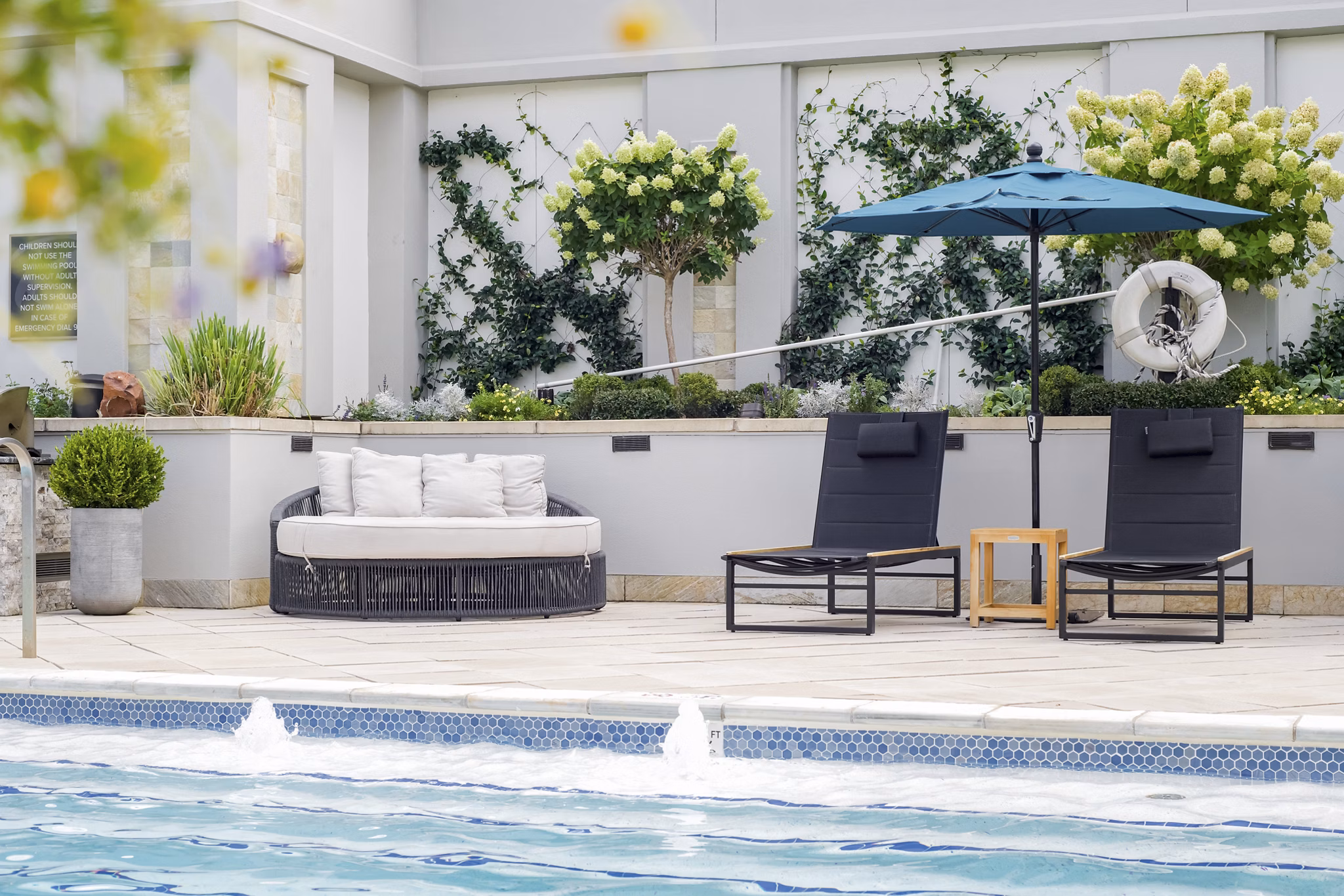 Elegant outdoor pool at The Residence at SouthPark Apartments offering luxury leisure and relaxation