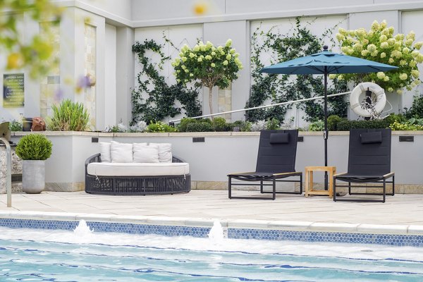 Elegant outdoor pool at The Residence at SouthPark Apartments offering luxury leisure and relaxation