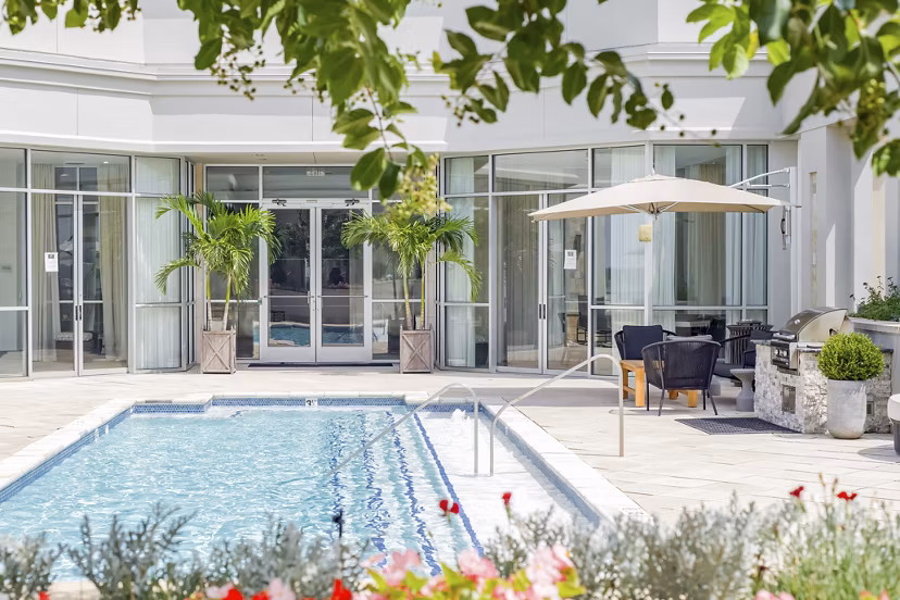 Resort-style pool at The Residence at SouthPark Apartments, offering luxury leisure amenities for residents