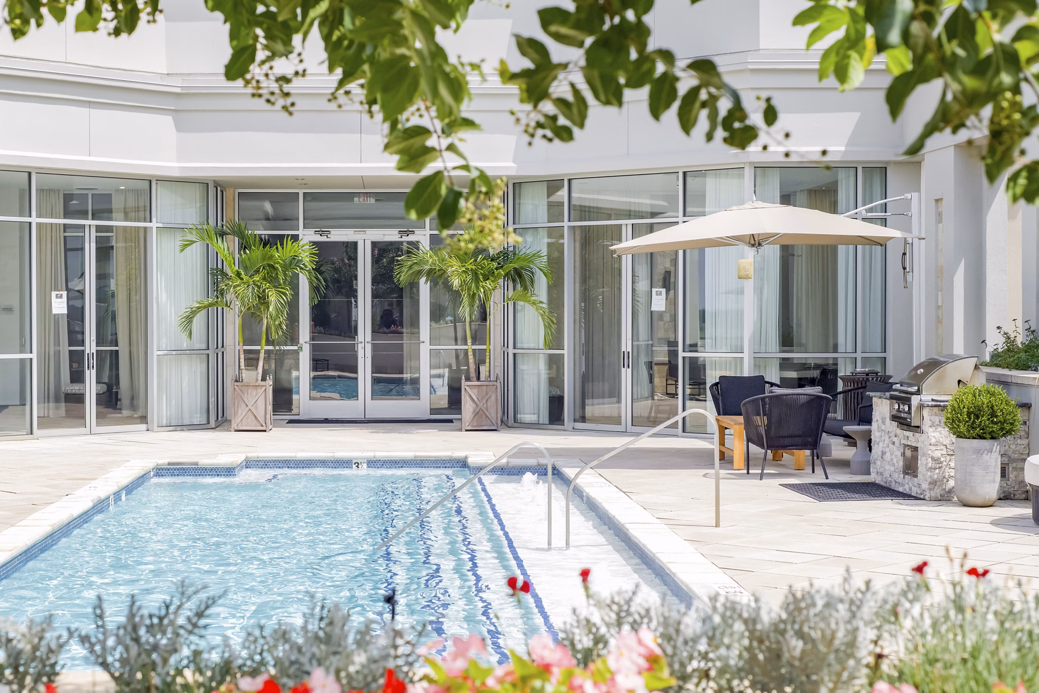 Resort-style pool at The Residence at SouthPark Apartments, offering luxury leisure amenities for residents