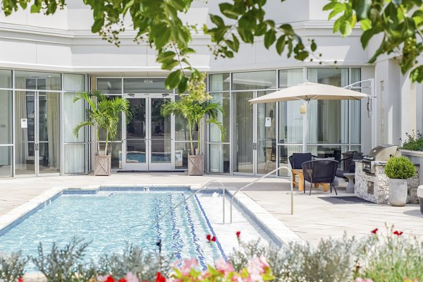 Resort-style pool at The Residence at SouthPark Apartments, offering luxury leisure amenities for residents