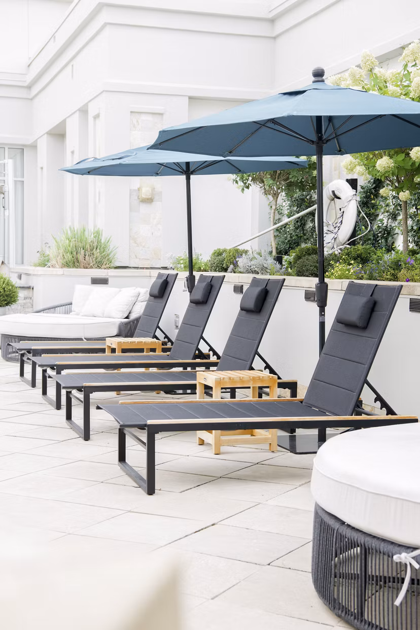 Elegant patio space with modern seating at The Residence at SouthPark Apartments, perfect for relaxation and social gatherings