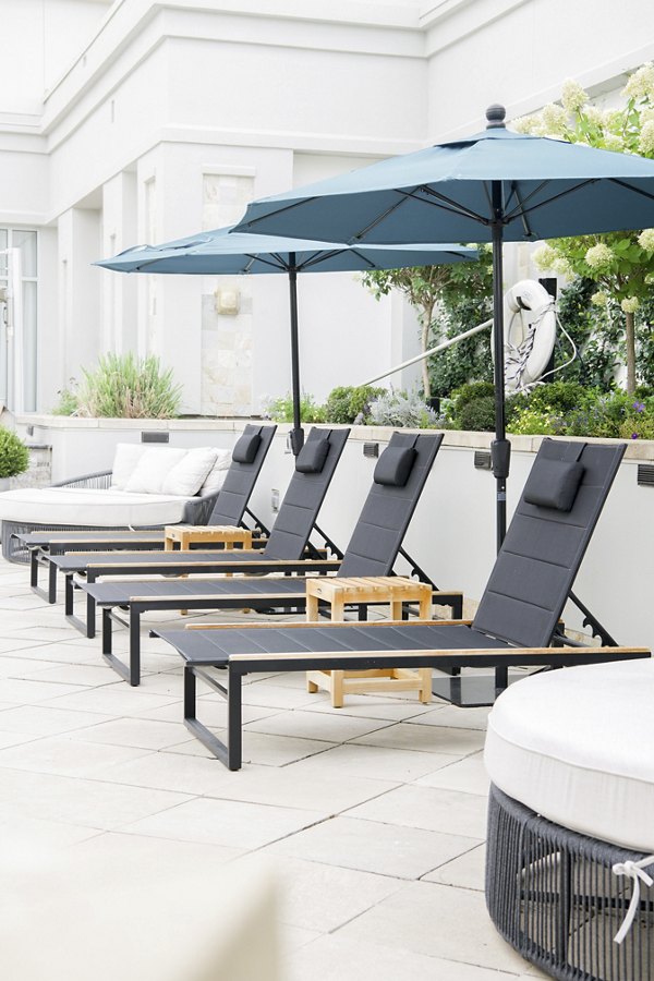 Elegant patio space with modern seating at The Residence at SouthPark Apartments, perfect for relaxation and social gatherings