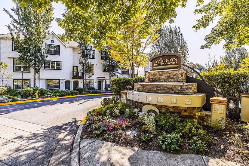 Avignon Townhomes: Classic townhome-style apartments with greenery and balcony views