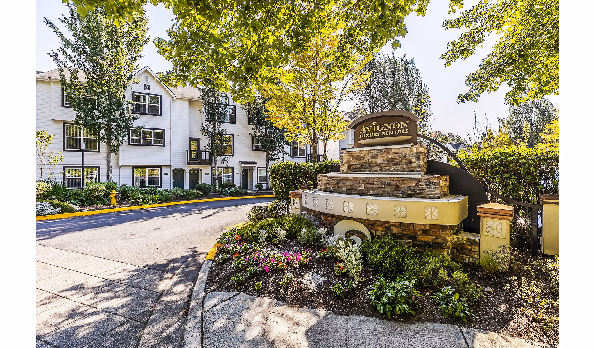 Avignon Townhomes: Classic townhome-style apartments with greenery and balcony views