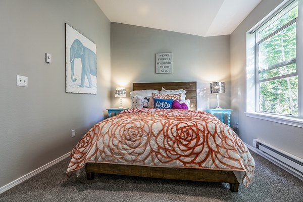 Bedroom featuring elegant design and plush furnishings in Avignon Townhomes Apartments