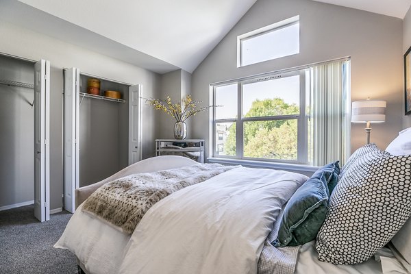 Modern bedroom with natural light at Avignon Townhomes Apartments