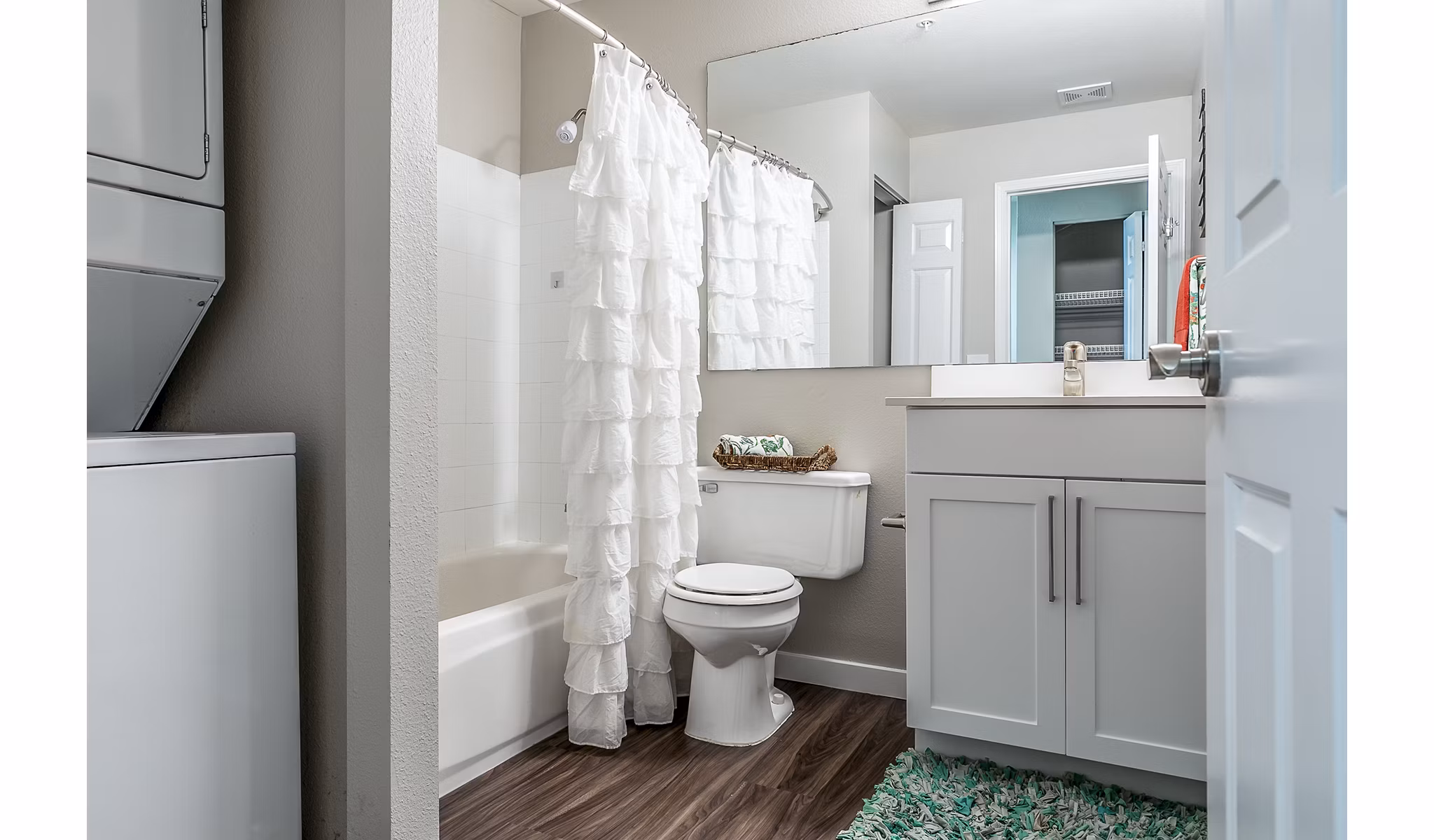 Modern bathroom featuring marble countertops and glass shower in Avignon Townhomes Apartments