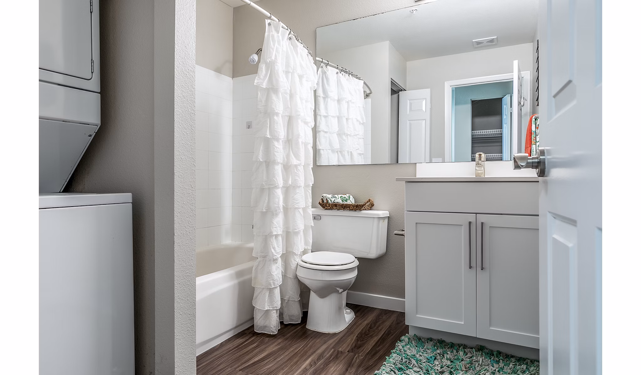 Modern bathroom featuring marble countertops and glass shower in Avignon Townhomes Apartments