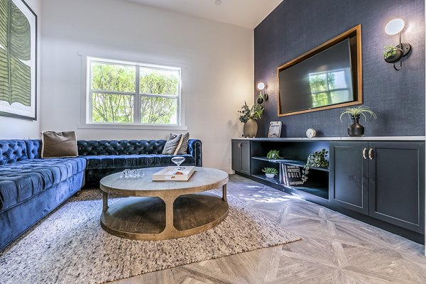 Cozy clubhouse theater with plush seating at Avignon Townhomes Apartments, ideal for private screenings and community events