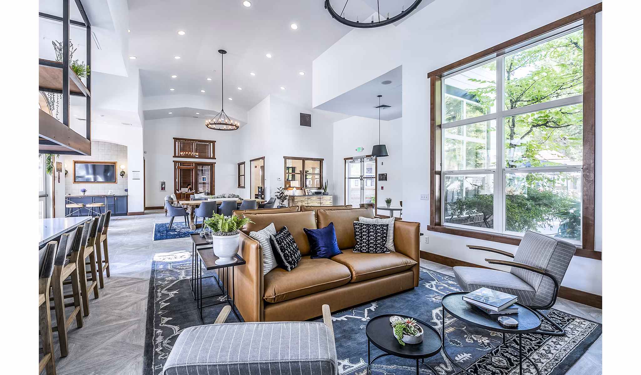 Clubhouse lobby featuring modern decor and cozy seating at Avignon Townhomes Apartments
