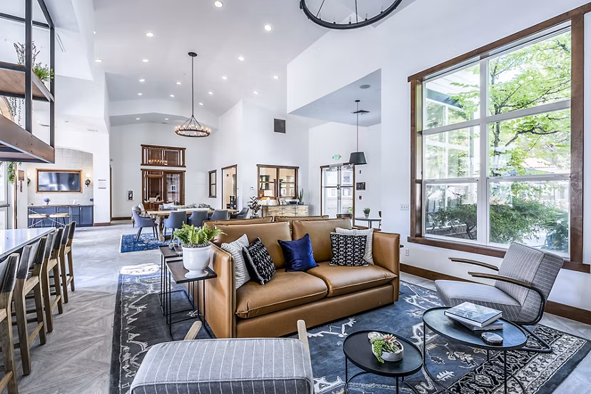 Clubhouse lobby featuring modern decor and cozy seating at Avignon Townhomes Apartments
