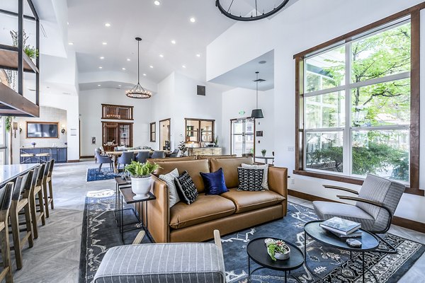 Clubhouse lobby featuring modern decor and cozy seating at Avignon Townhomes Apartments