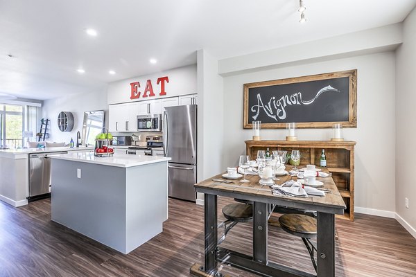Dining room featuring elegant decor and modern furnishings at Avignon Townhomes Apartments