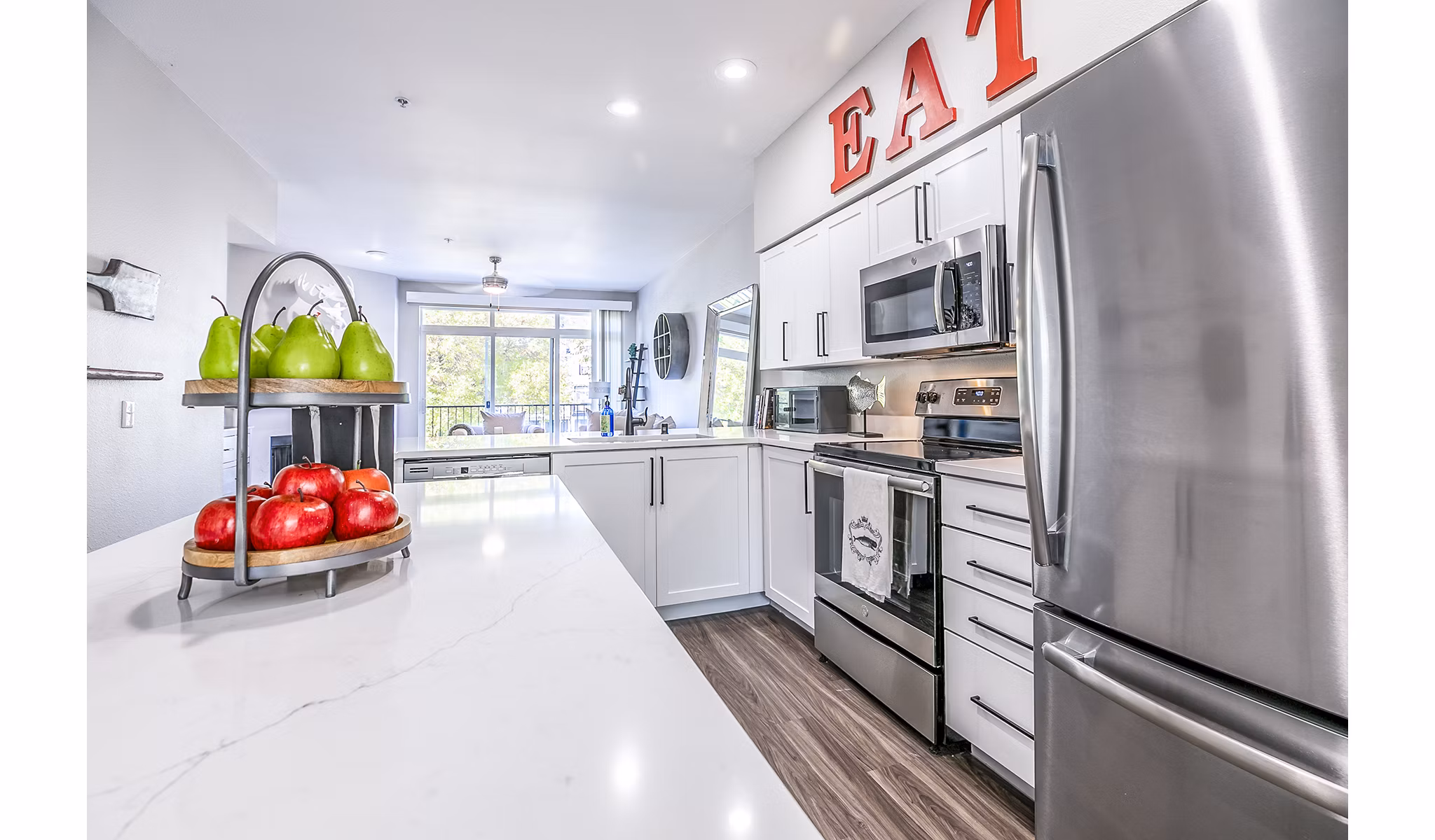 Contemporary kitchen with stainless steel appliances in Avignon Townhomes Apartments
