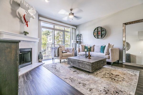 Airy living room with modern decor and plush seating at Avignon Townhomes Apartments, offering a luxury living experience