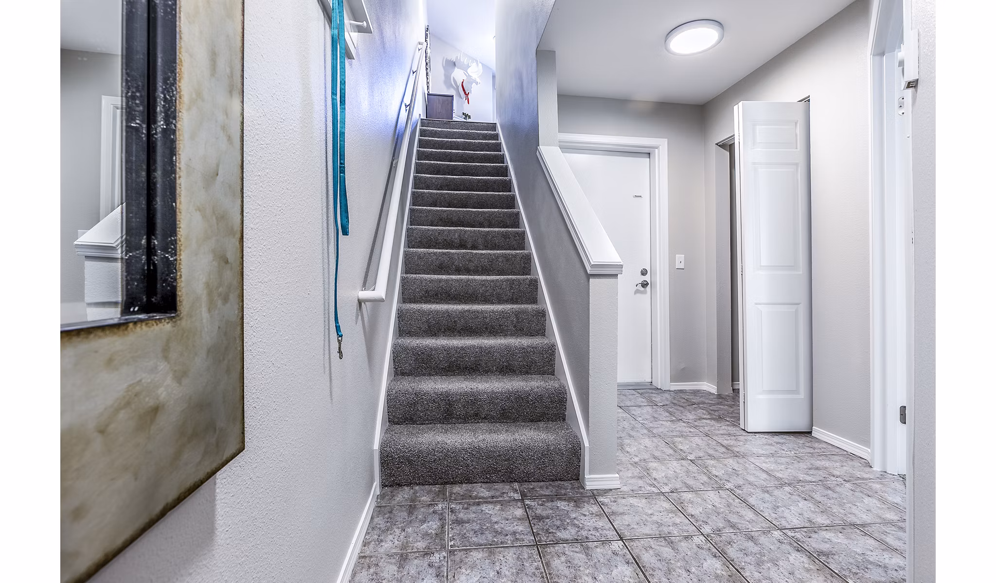 Elegant stairway design in Avignon Townhomes Apartments, featuring modern architecture and sleek finishes