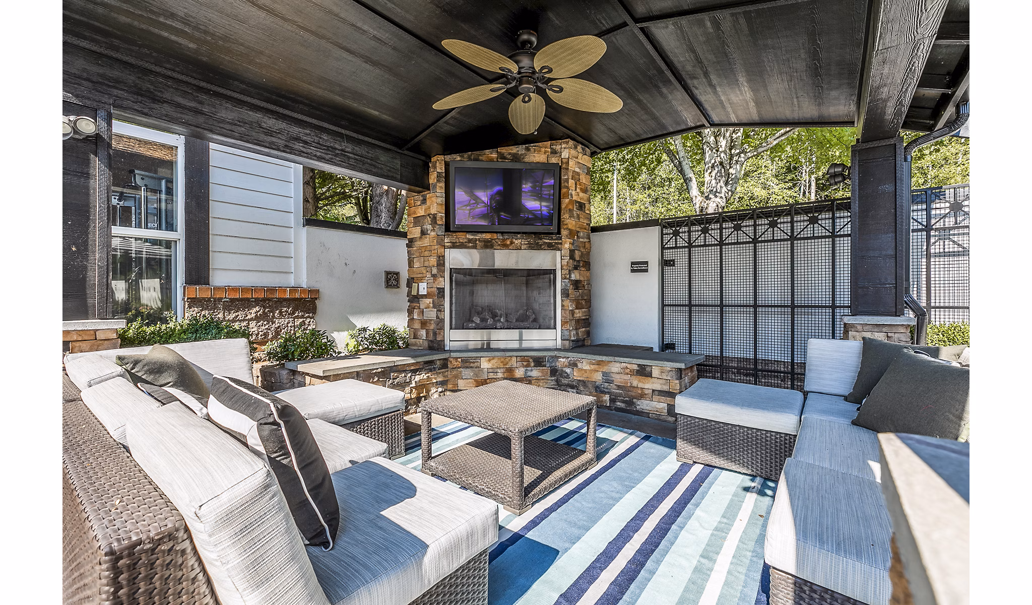 Cozy outdoor fire pit with seating at Avignon Townhomes Apartments