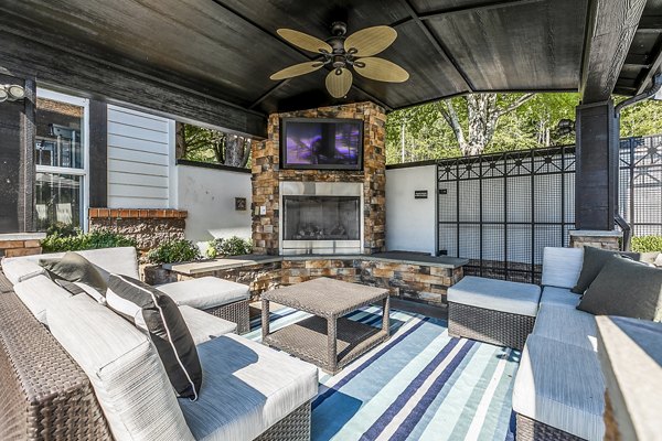 Cozy outdoor fire pit with seating at Avignon Townhomes Apartments