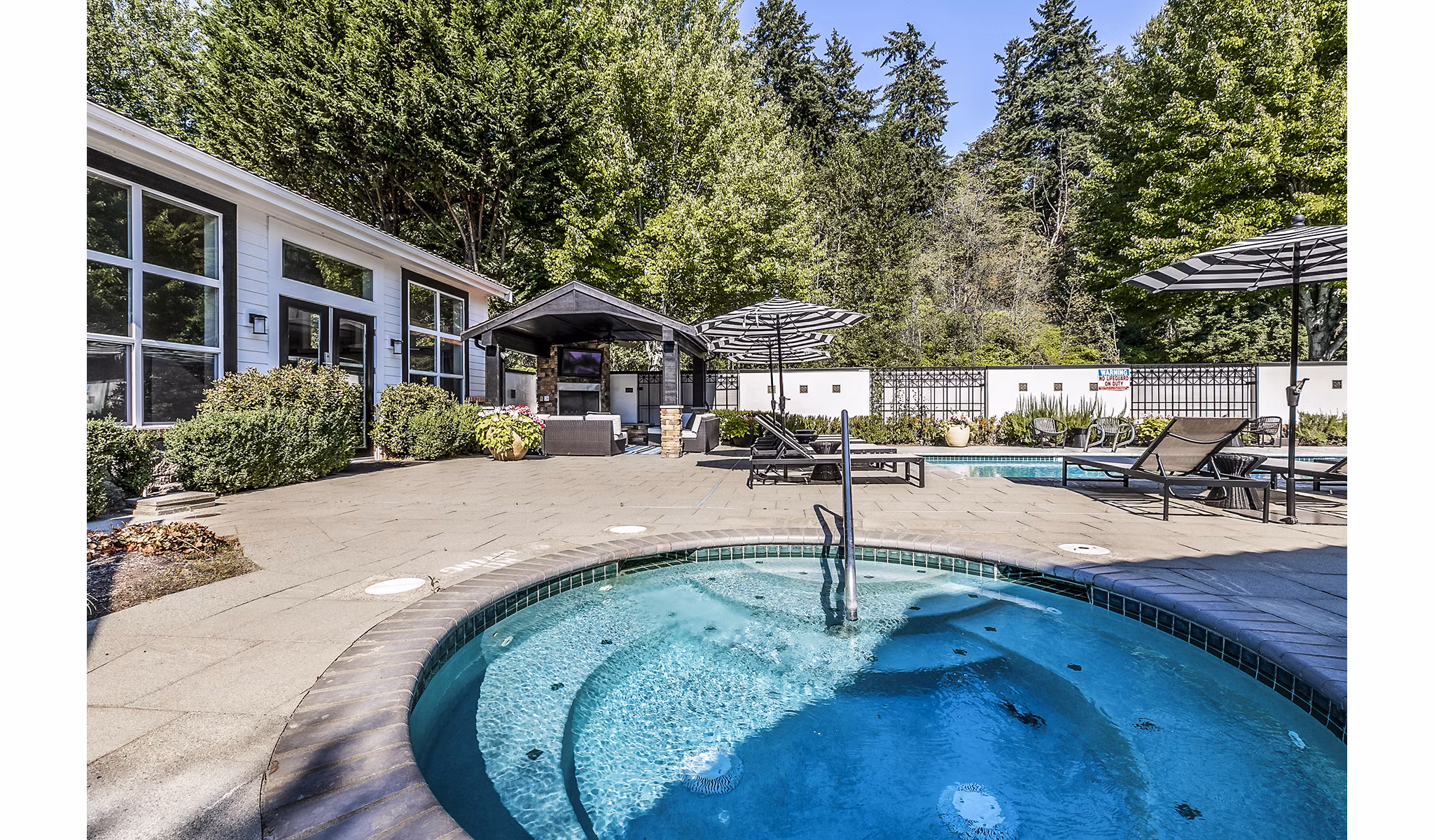 Hot tub amenity at Avignon Townhomes Apartments offering luxury relaxation in a scenic setting