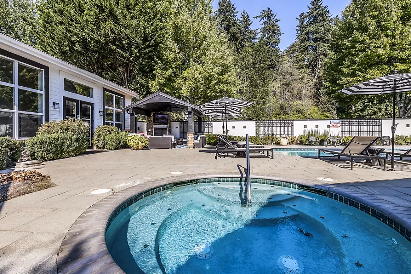 Hot tub amenity at Avignon Townhomes Apartments offering luxury relaxation in a scenic setting