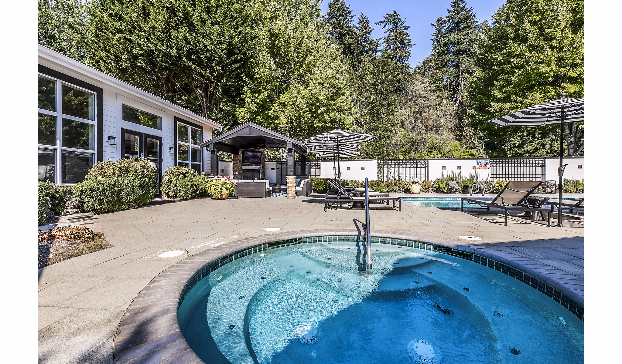 Hot tub amenity at Avignon Townhomes Apartments offering luxury relaxation in a scenic setting