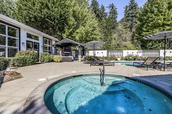 Hot tub amenity at Avignon Townhomes Apartments offering luxury relaxation in a scenic setting