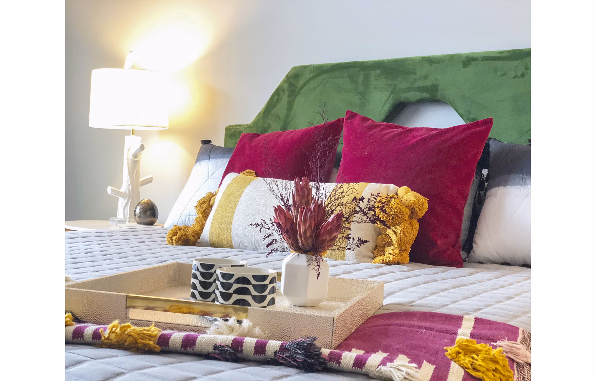 Modern bedroom featuring elegant decor and large windows at Savoy Apartments