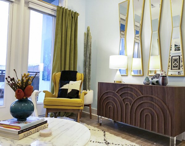 Spacious living room with modern furnishings in Savoy Apartments