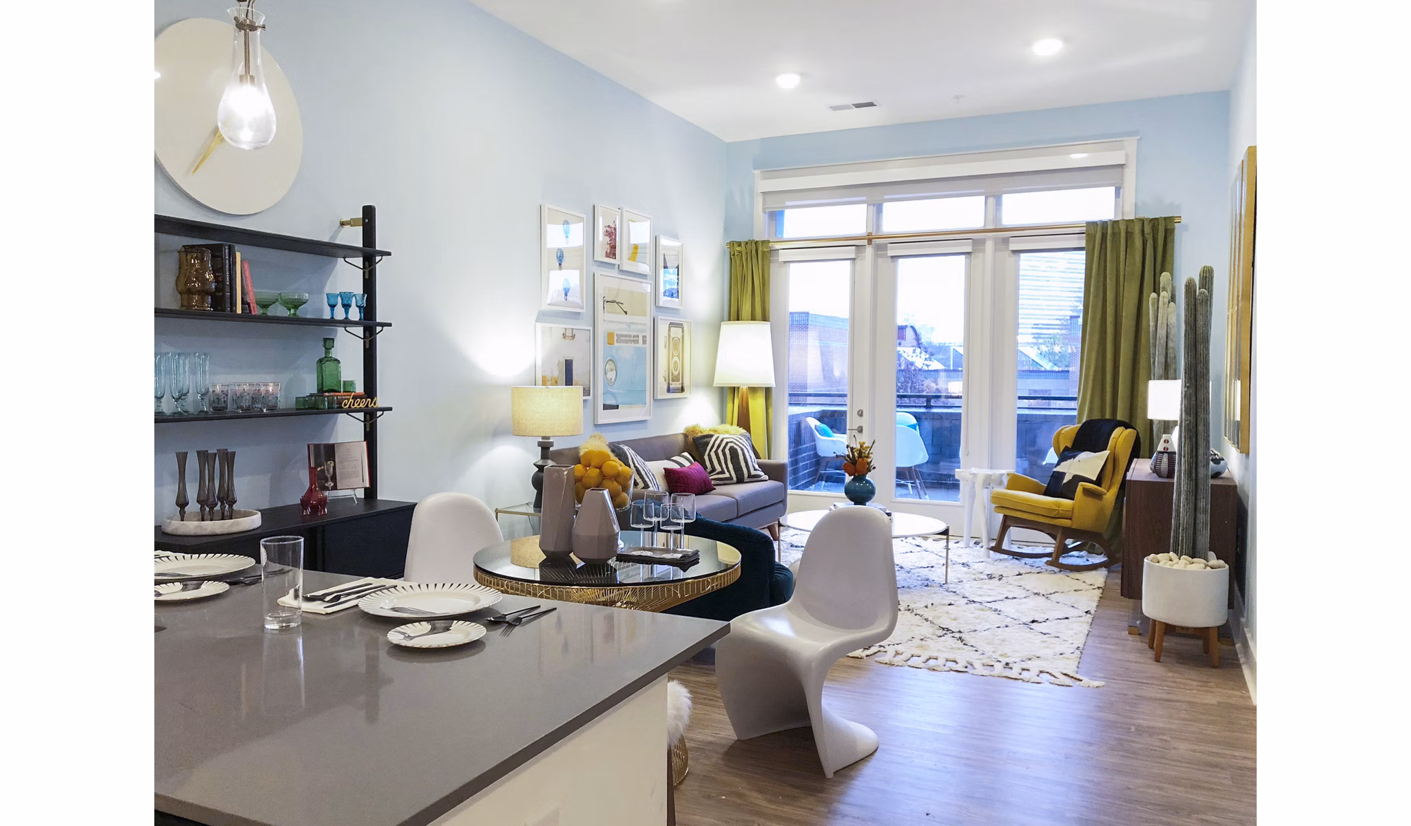 Living room with contemporary decor and natural light at Savoy Apartments, luxury property by Greystar