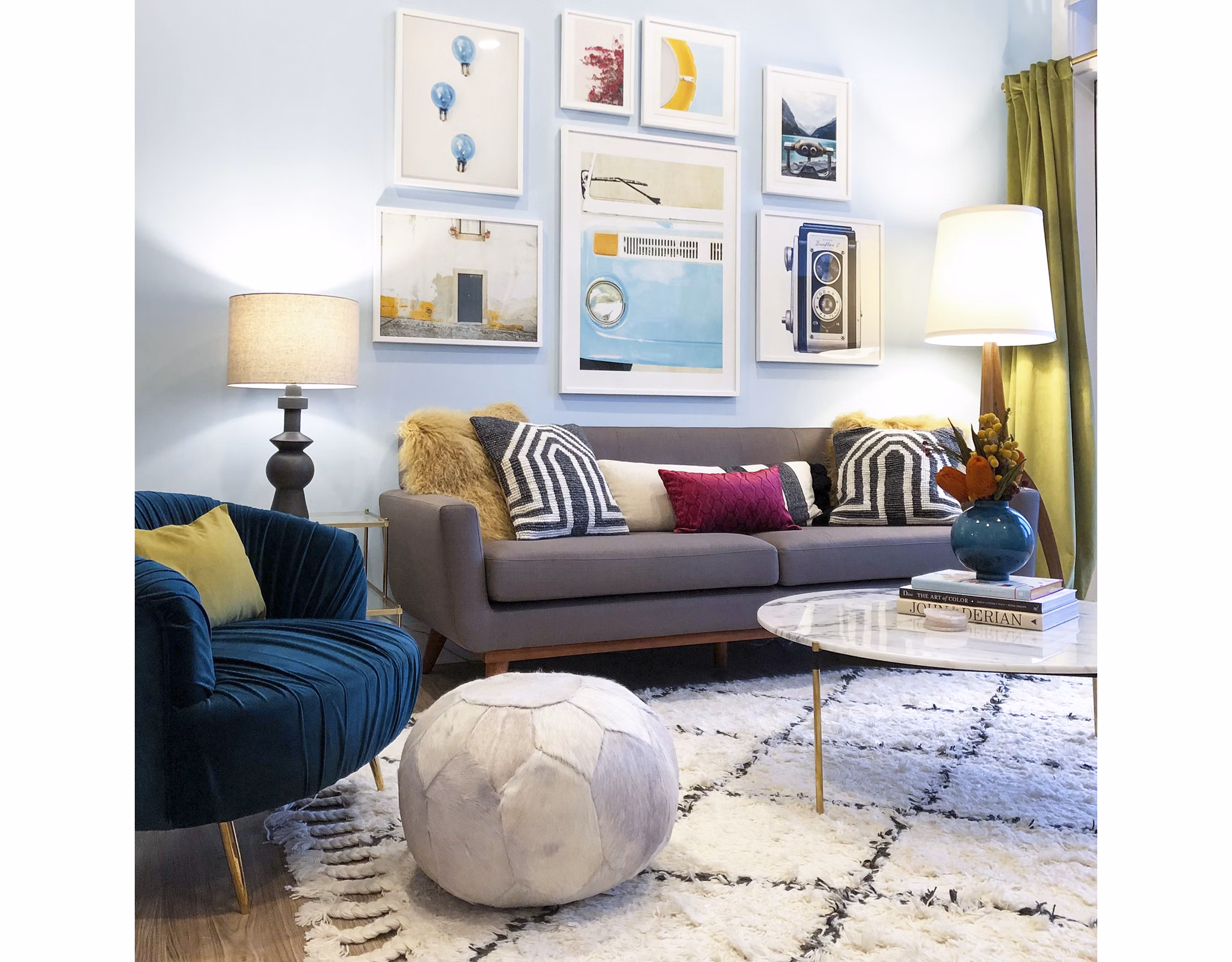 Living room featuring modern decor and abundant natural light in Savoy Apartments