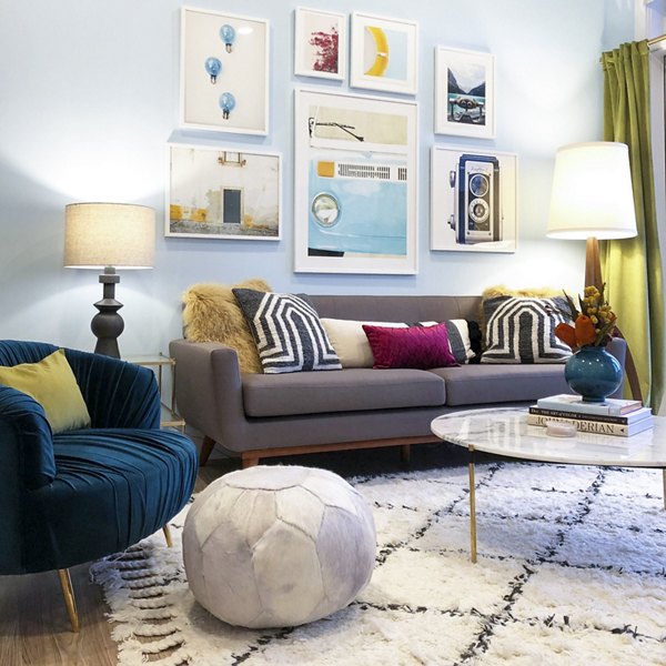 Living room featuring modern decor and abundant natural light in Savoy Apartments