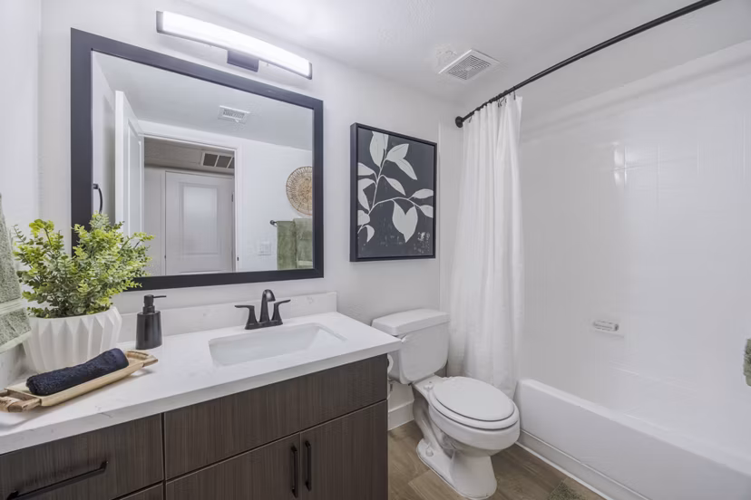 Spa-style bathroom with double vanity and modern fixtures at Sage at Green Valley Apartments Perfect blend of luxury and comfort for urban living