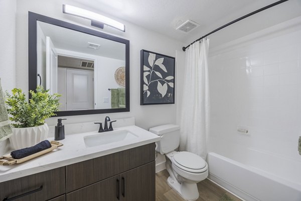 Spa-style bathroom with double vanity and modern fixtures at Sage at Green Valley Apartments Perfect blend of luxury and comfort for urban living